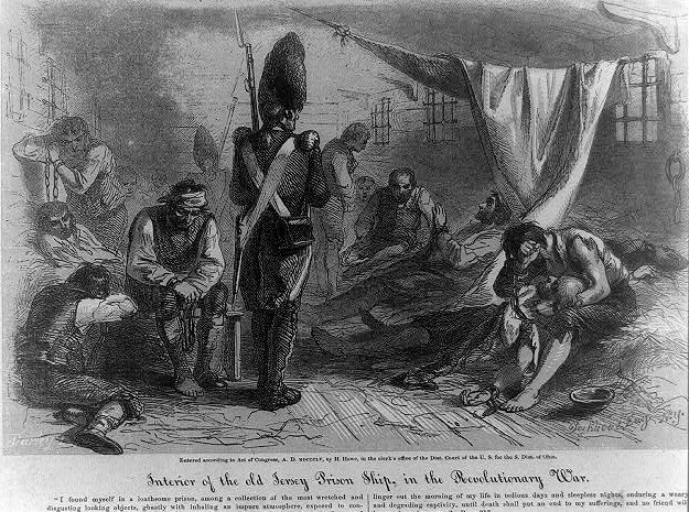 Wikipedia - Interior of the old Jersey prison ship, in the Revolutionary War / Darley ; Bookhout, eng. N.Y./ Interior view of the Jersey, a British prison ship during the Revolutionary War, showing prisoners and guard. Source indicates LOC as original source of image. https://www.loc.gov/pictures/item/00649772/.